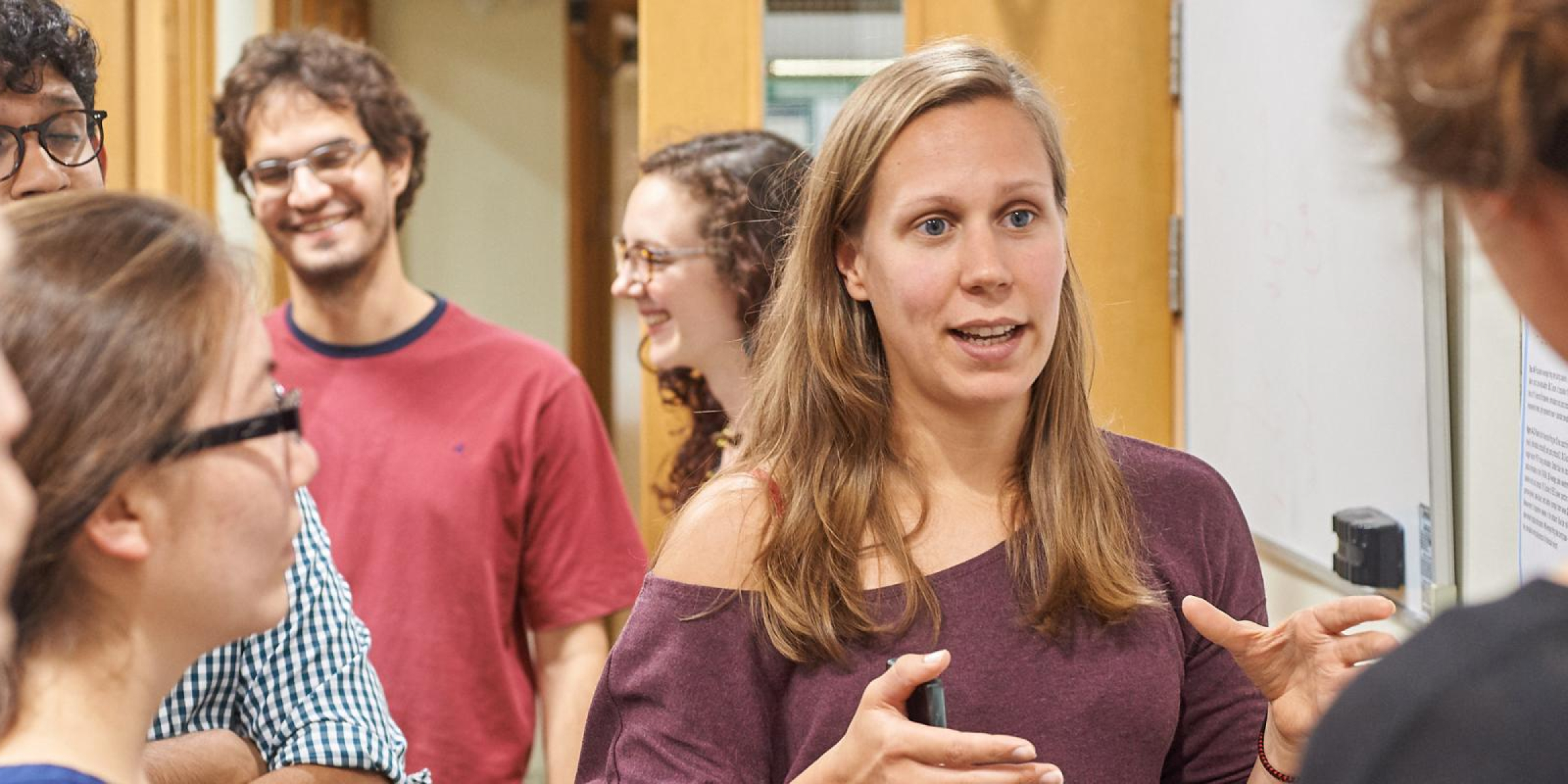 people talking in a poster session
