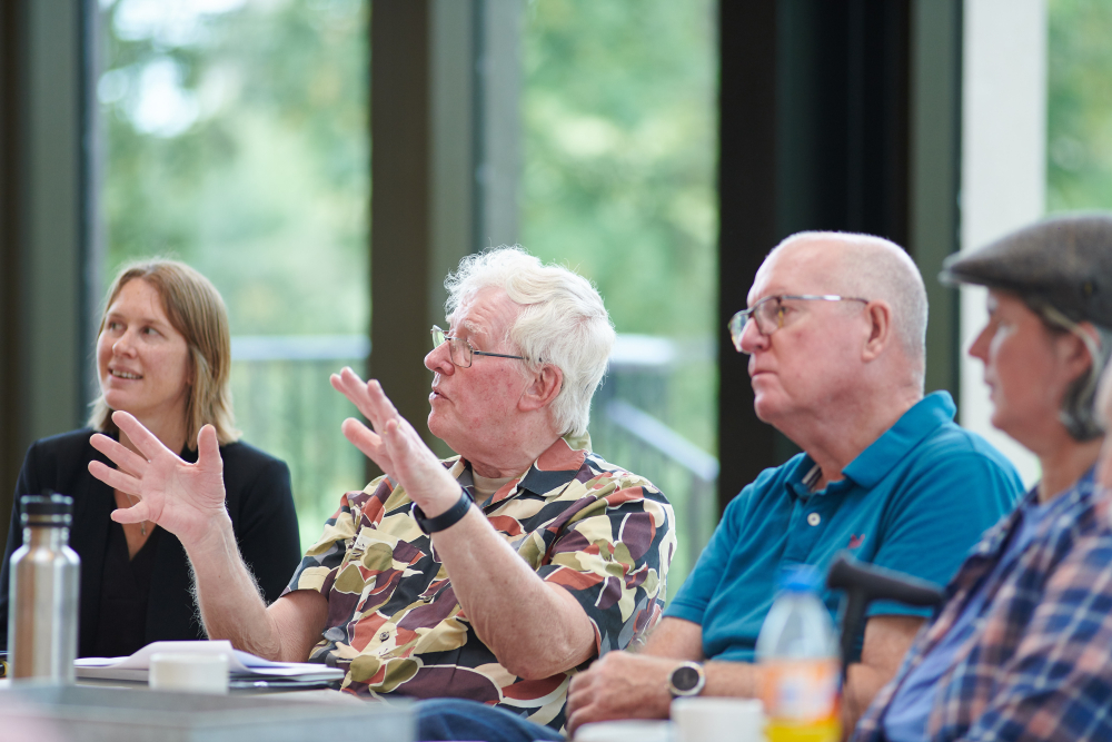 a person speaking, using their hands for emphasis